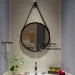 Decor mirror with hanging strap