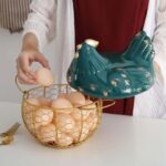 Gold egg holder with chicken cover