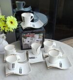 White 12pc cup and saucer set with gold rim