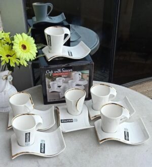 White 12pc cup and saucer set with gold rim