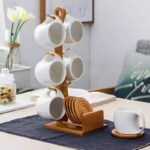 White cup set with bamboo stand and coasters